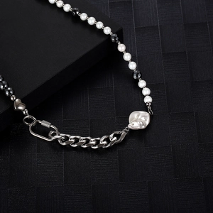 Detail of hip-hop pearl necklace with black hematite and large baroque pearl pendant