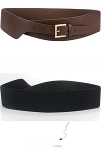 Detail of wide elastic waist belt with brown leather front and gold metal buckle