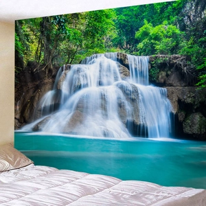 Detailed close-up of a forest waterfall tapestry hanging over a bedroom bed