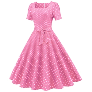 Detail of square neckline and waist bow on pink polka dot dress with A-line skirt