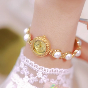 Elegant gold quartz watch for women featuring white faux pearl and chain bracelet