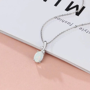 Elegant oval white opal necklace with clear zircon accents on a silver chain for women