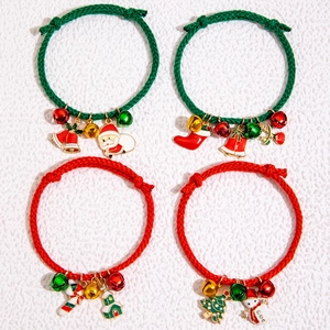 Christmas charms bracelets with Santa Claus and reindeer pendants on red and green ropes