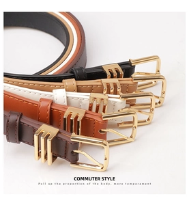 Close-up of five stylish PU leather belts for women with gold metal buckles and loops