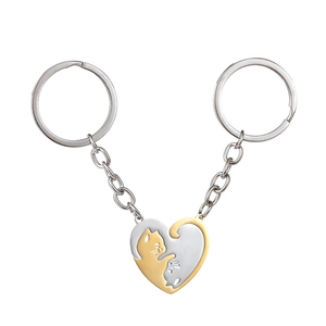 Polished black and white interlocking cat heart pendants on stainless steel keychains