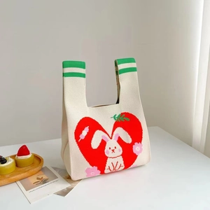 Knitted tote bag in cream with red heart, white bunny and floral pattern details