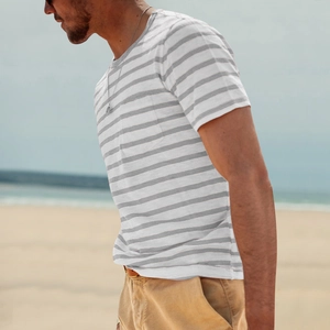 Side view of men's grey and white striped short sleeve t-shirt with chest pocket