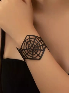 Close-up of black spider web open cuff bracelet with punk hollow design on model wrist