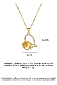 Detail of rose and heart pendant showing dimensions of 2.9cm by 2.0cm on gold chain