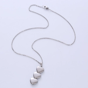 Minimalist silver stainless steel necklace featuring a triple heart-shaped pendant design