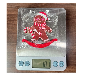 Christmas gingerbread man wooden rocking horse decoration weighing 18.1g on scale