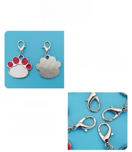 Polished aluminum dog tag with red and white paw print design and lobster clasp