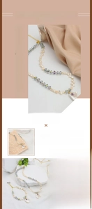 Detailed macro view of baroque freshwater pearls and 18K gold plated branch pendant