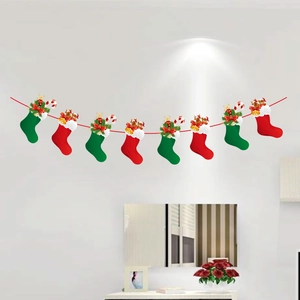 Detail of Christmas stocking banner with red bows, golden bells, and Santa Bear motifs