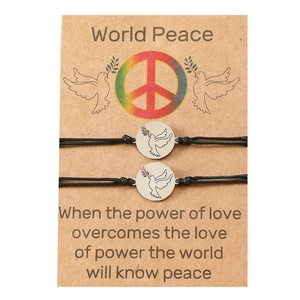 Handmade braided peace dove bracelet set with olive branch charm on kraft card