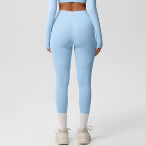 Detail view of high waisted light blue yoga pants with ergonomic back seam construction