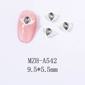 Detail view of heart wing alloy nail charms with grey teardrop gemstones, size 9.5x5.5mm