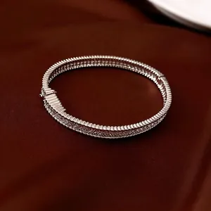 Luxury silver-tone buckle bangle featuring multi-layer zircon micro-paving and wavy design