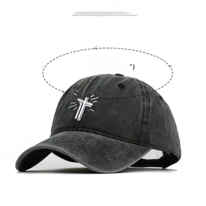 Close-up of cross embroidery and dimensions on vintage washed cotton baseball cap