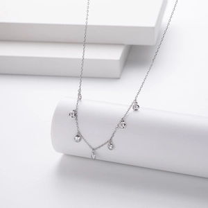 Minimalist S925 sterling silver necklace featuring seven bezel-set cubic zirconia stones