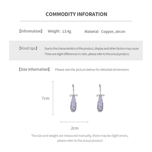 Detailed size chart showing silver bow drop earrings with 7cm length and 2cm width