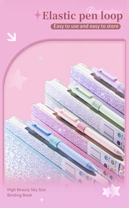 Detail view of colorful glitter A5 journals featuring elastic pen loops and strap closures