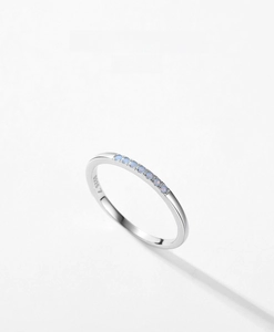 Macro detail of S925 sterling silver ring featuring blue gemstones and S925 hallmark