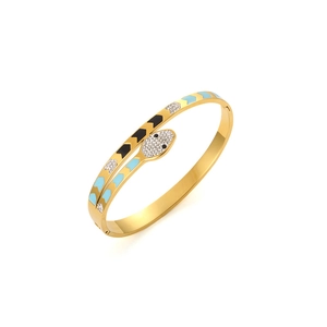 Detailed macro of gold snake bracelet featuring blue enamel scales and sparkling zircons