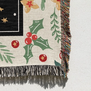 Detailed close-up of Christmas jacquard woven blanket featuring festive tassels and patterns