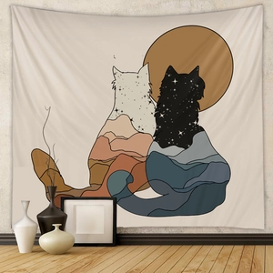 Detail of bohemian tapestry featuring silhouette cats with starry mountain landscape