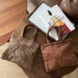 Vintage khaki and brick red suede handbags with floral embroidery and textured jacquard