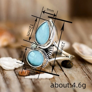 Anello vintage argentato da donna con due pietre blu a forma di goccia e ovale