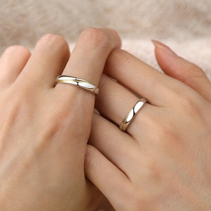 S925 sterling silver couple rings with gold wave line accents worn on hands