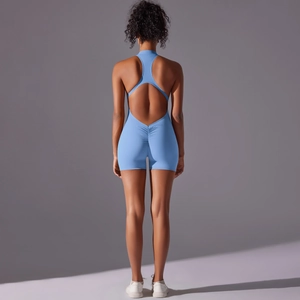 Detailed back view of light blue backless yoga romper with V-shaped lifting seam