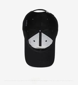Detailed interior of black baseball cap showing white lining and embroidery stitch work