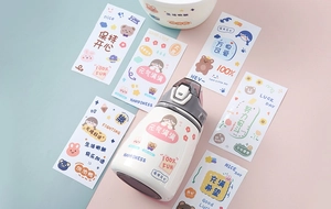 Close-up of cute cartoon stickers on a cream insulated water bottle with a straw lid