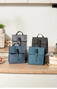 Detailed view of insulated lunch bags in four colors with buckle closure and sturdy handles