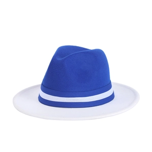 Detail of royal blue fedora hat with white brim and striped grosgrain ribbon detail