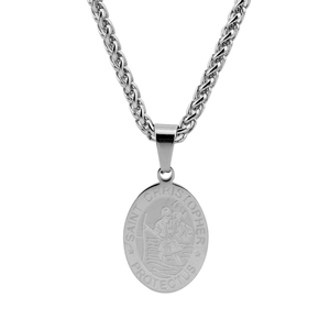 Detail shot of Saint Christopher religious medallion on a silver wheat chain necklace