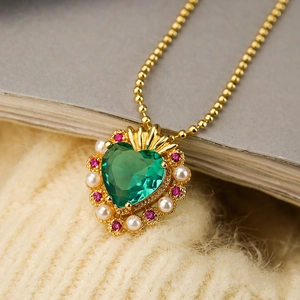 Elegant heart pendant necklace with green crystal and pearls on a gold bead chain