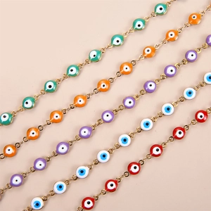 Gold stainless steel evil eye bracelet featuring vibrant multi-colored enamel beads