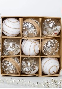 Close-up of 9-piece Christmas ornaments featuring reindeer and snowflake motifs in a kraft box
