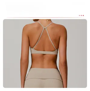 Detail of cross-back yoga bra with thin straps in a quick-dry khaki nude-feel fabric