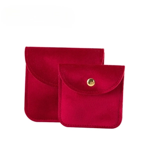 Thick red velvet jewelry pouch with gold snap button for bracelet storage