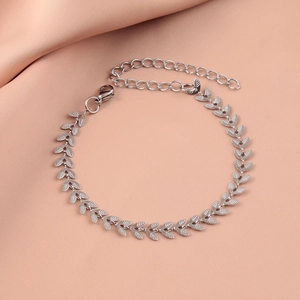 Polished silver stainless steel leaf chain bracelet for women on elegant silk fabric