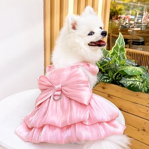 Detail of pink satin pet princess dress with large bow and metal D-ring for leash