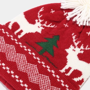 Three-piece Christmas knit set with reindeer and tree patterns including hat and scarf