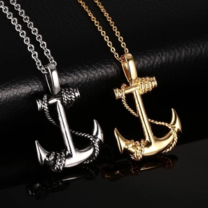 Men's anchor pendant necklaces in silver and gold finish with rope detail on black surface
