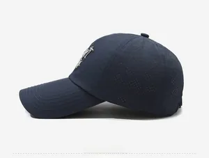 Detailed side view of navy blue baseball cap showing laser-cut V-shape ventilation holes