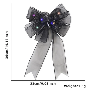 Detail of Halloween black lace bow with colorful LED lights and measurement markers
